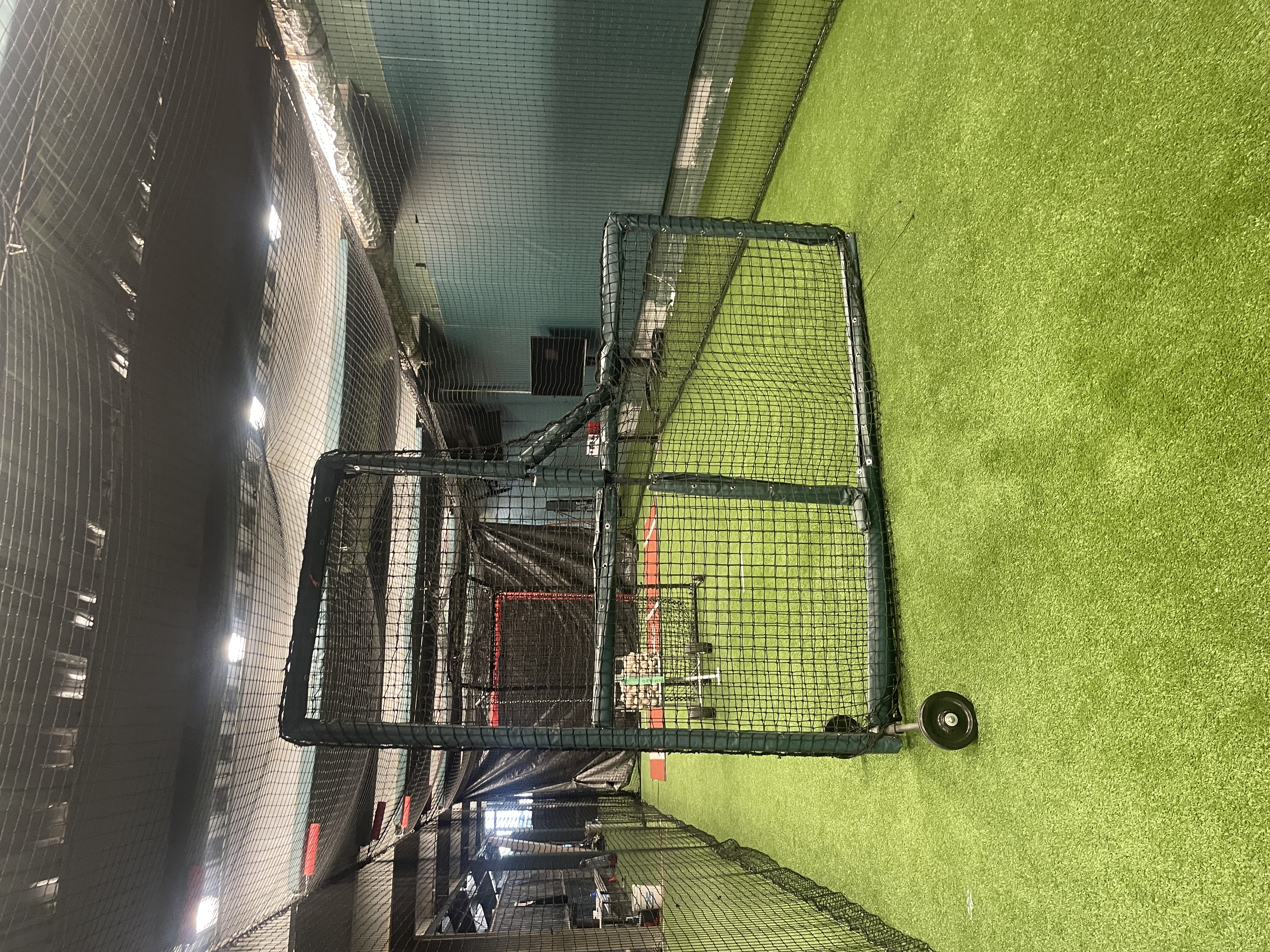 Indoor batting cage facility